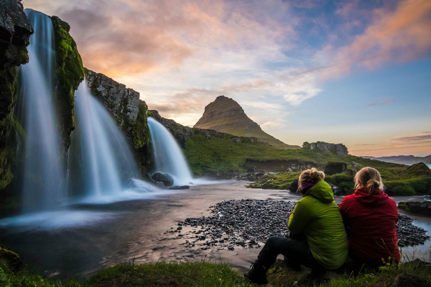 Spectacular. Fantastic view on Kirkjufellsfoss Waterfall near Kirkjufell Mountain at Sunset. Iceland is a Happy Country with Happy people.